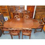 A Continental early 20thC oak dining room suite, stylistically carved with flowers and scrolling