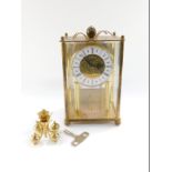 A Haller German brass four hundred day Anniversary clock, the circular dial bearing Roman