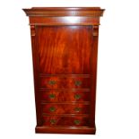 A reproduction mahogany gun cabinet, the dentil moulded pediment over a four dummy drawer, single