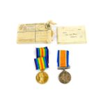 A pair of Great War medals, named to Pte E W Clay, Manchester Regiment, 40009, comprising Great