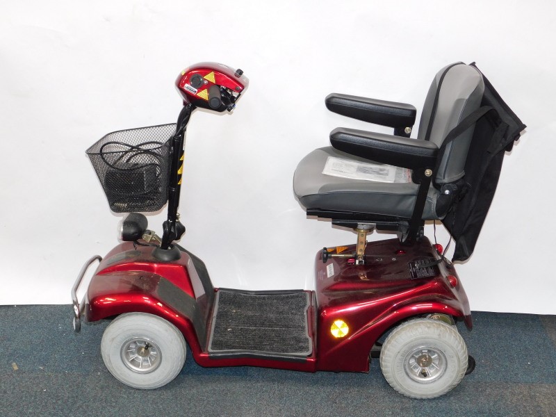 A Rascal V88 mobility scooter, with battery and instructions.