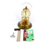 A Schatz brass four hundred day anniversary clock, circular cream dial bearing Arabic numerals,