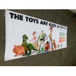 An advertising film banner Toy Story, The Toys Are Back In Town, 120cm x 307cm.