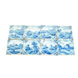 Eight 18thC Dutch delftware tiles, decorated with landscapes and riverscapes within circular