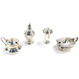 A George V silver pepperette, Birmingham 1919, a Victorian silver pepperette, Chester 1900, a George