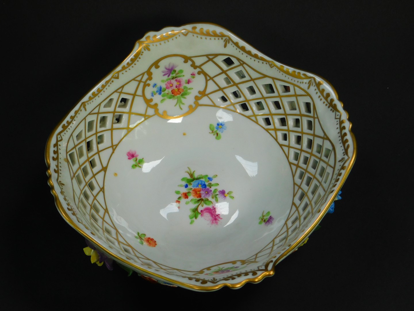 A 20thC Dresden porcelain bowl, of pierced form, encrusted and painted with flowers, raised on - Image 2 of 3