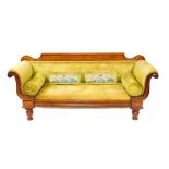 A late Regency mahogany scroll end sofa, upholstered in green draylon raised on baluster turned