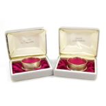 A pair of silver napkin rings, with engine turned decoration, rectangular reserve, boxed, Birmingham