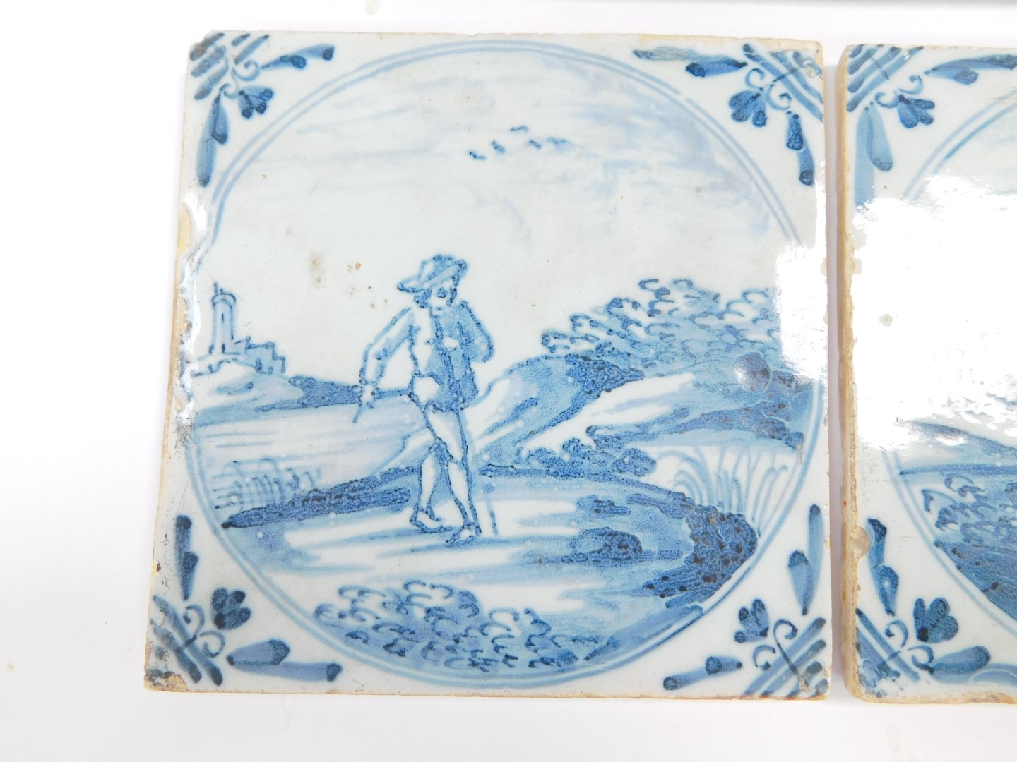 Five 18thC Dutch delftware tiles, decorated with men and women in rural settings, within circular - Image 2 of 3