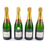 Four bottles of Tesco Premium Cru Champagne.