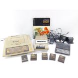 An Atari 400 personal computer, 410 programme recorder, computer games and an operator's manual,