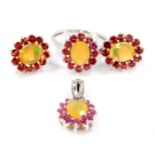 A silver Ethiopian opal and Rajasthan garnet ring, size N/O, together with a matching pendant and