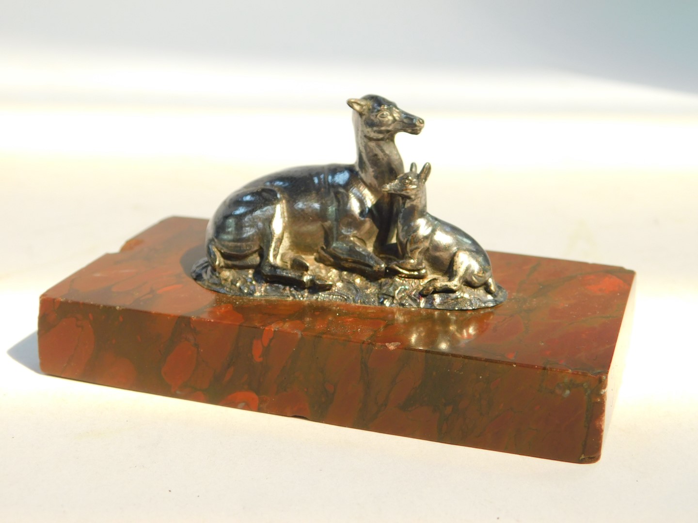 A Victorian paperweight cast as a recumbent doe and fawn, white metal, on a rectangular red marble - Image 5 of 5