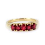 A 9ct gold and red spinel five stone ring, 1.12cts, size N/O, 2.03g gold, with certificate.