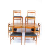 A Mackintosh teak double leaf extending dining table, raised on turned legs, 158cm wide, 234cm