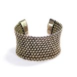 A Suarti silver cuff bangle, of wide basket weave design, 59g.