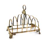 A William IV silver six division toast rack, raised on acanthus leaf scroll feet, Henry