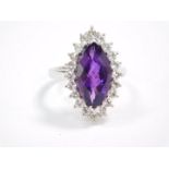 A silver and marquise cut Zambian amethyst ring, in a surround of white topaz, amethyst 3.97 carats,