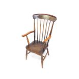 A Victorian oak and elm lady's stick back kitchen chair, raised on turned legs united by an H