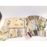 Edwardian and later topographical postcards and greetings cards, together with a Victorian scrap
