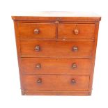 A Victorian mahogany straight fronted chest, of two short over three long drawers, raised on a