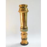 A vintage brass fireman's hose nozzle, serial no. 443, 32.5cm long.