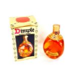 A Dimple bottle of Scotch Whisky, 70% proof, 26 2/3 fl oz, boxed.