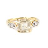 A 9ct gold serenite and diamond ring, the octagonal claw set serenite with diamond set shoulders,