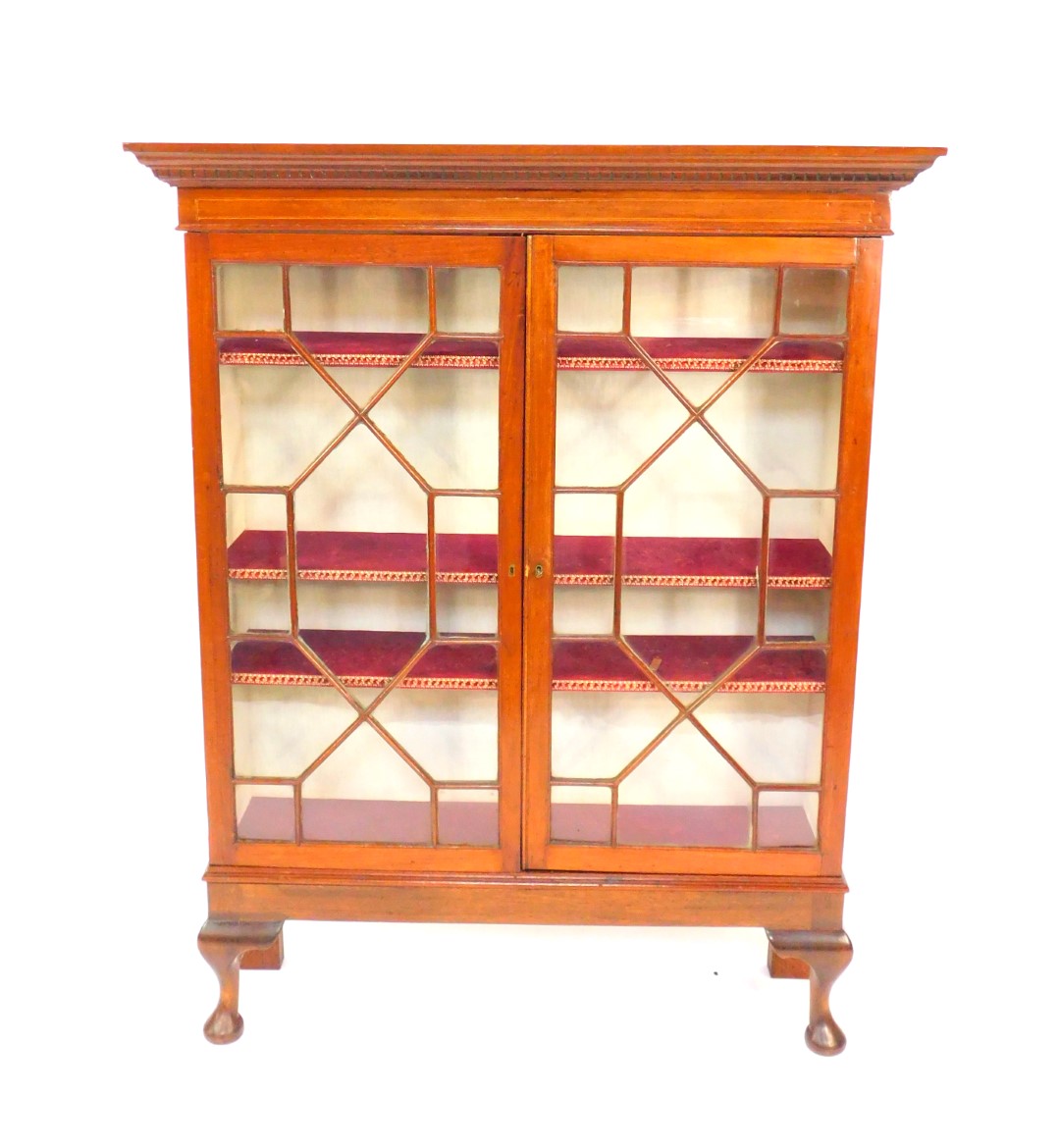 A Georgian and later mahogany display cabinet, the outswept pediment with dentil moulding, two