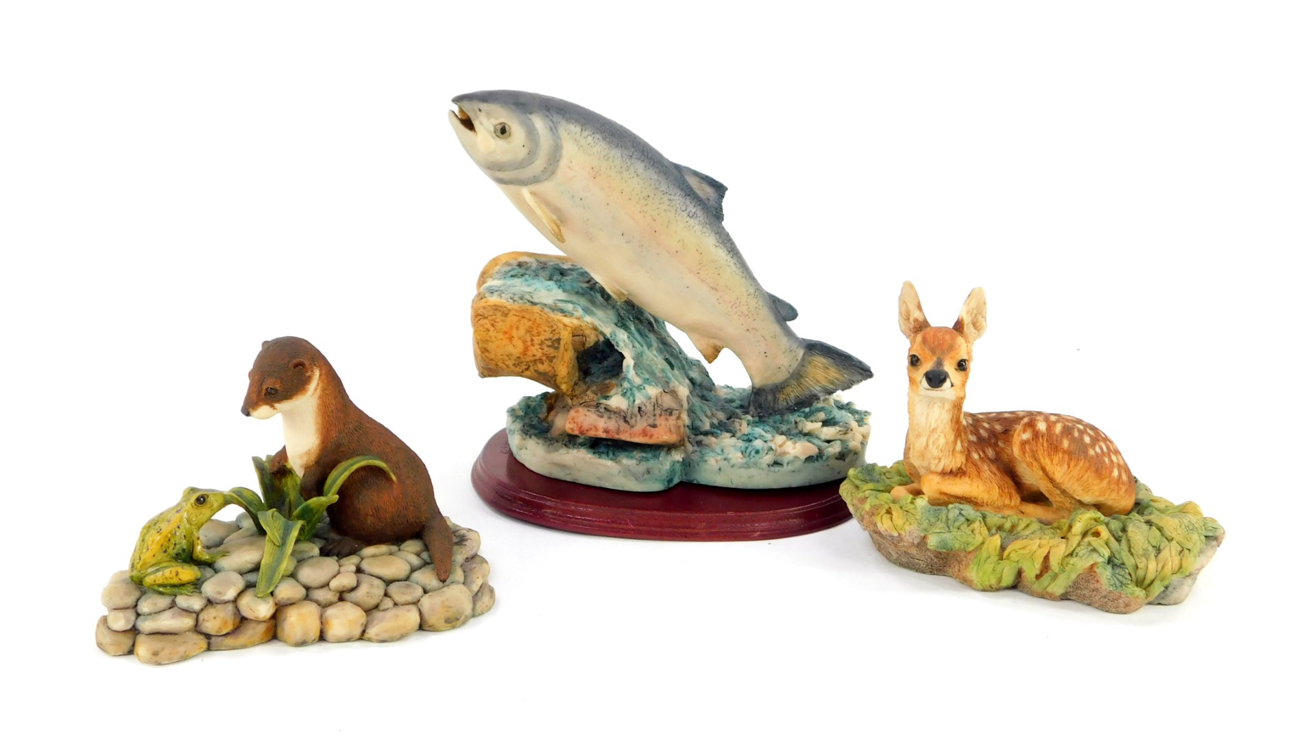 A Border Fine Arts sculpture of a leaping salmon, figure of a recumbent fawn, and an otter with