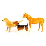 A Beswick figure of a Labrador Wendover, Beagle Wendover Billy, and a Palomino horse. (AF,3)