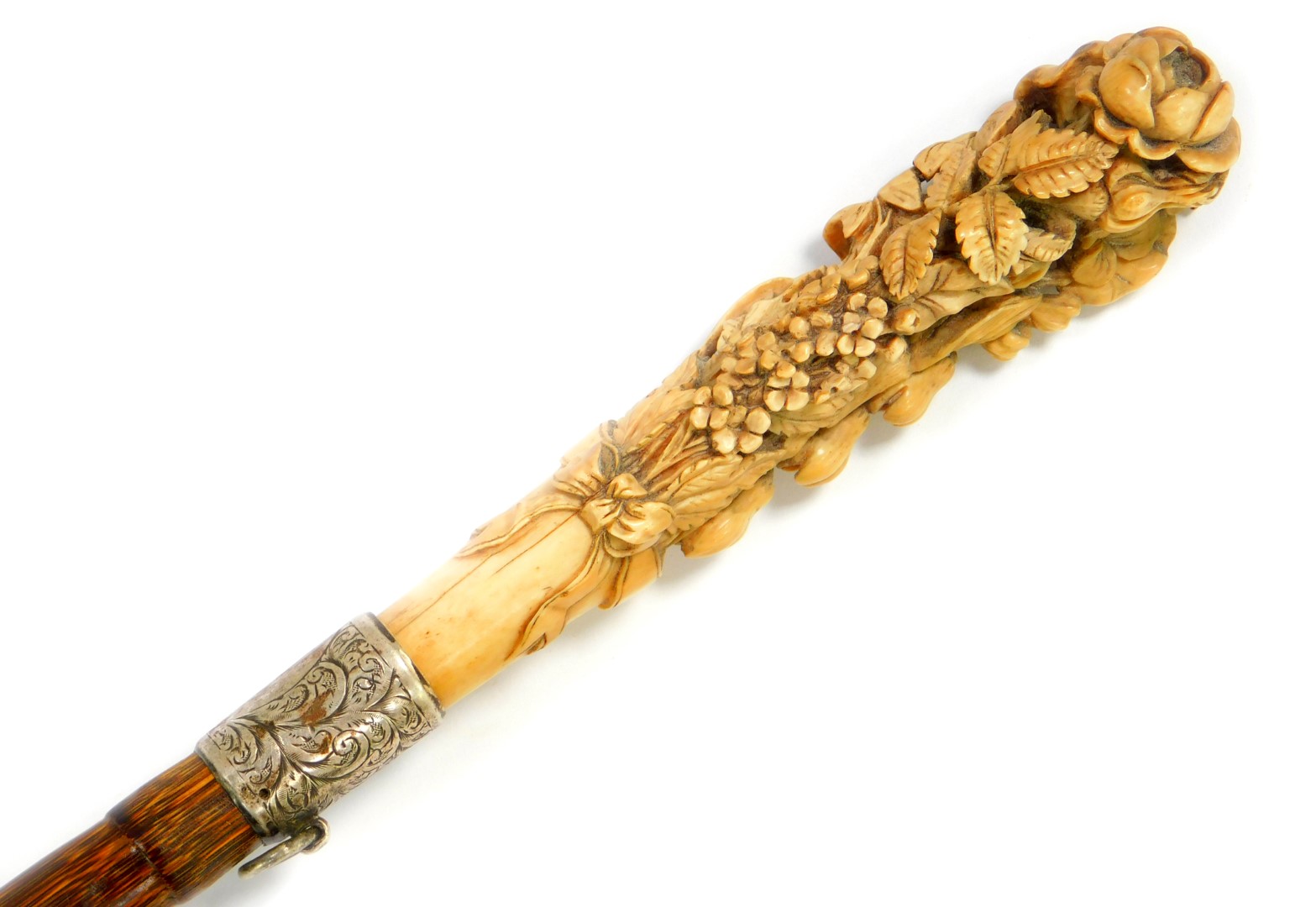 A Victorian lady's partridge wood walking cane, with an ivory handle carved with flowers and leaves,