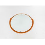 A G-Plan 1960's teak circular wall mirror, 49cm high, 52cm wide.