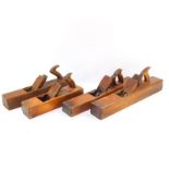 Four beech block planes, 55.5cm (2), 47cm and 43cm respectively.