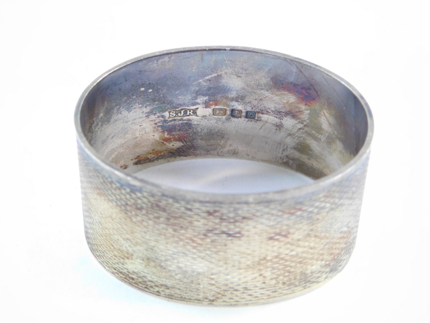 A silver napkin ring, with engine turned decoration, rectangular reserve monogram engraved, London - Image 7 of 9