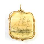 A Scrimshaw type pendant, with ship scene, in a yellow metal wire frame, unmarked.