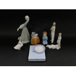 Lladro Nao porcelain figures, including a girl with a puppy and goose, No 866, boxed., kneeling