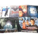 Six film posters, comprising Tomorrow Never Dies., Dracula., Independence Day., Catch Me If You