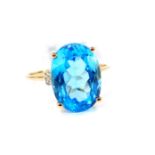 A 9ct gold and Swiss blue topaz ring, with zircon set shoulders, topaz 7.74 carats, size O, 1.68g