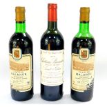 A bottle of Chateau Branaire St-Julian Grand Cru Classe 1979, high shoulder, together with two