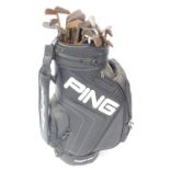 A Ping golf bag, containing a selection of vintage wooden shafted irons and putters, makers to