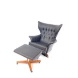 A G-Plan Blofeld black leather swivel chair, model 6250, on a red walnut frame on castors,