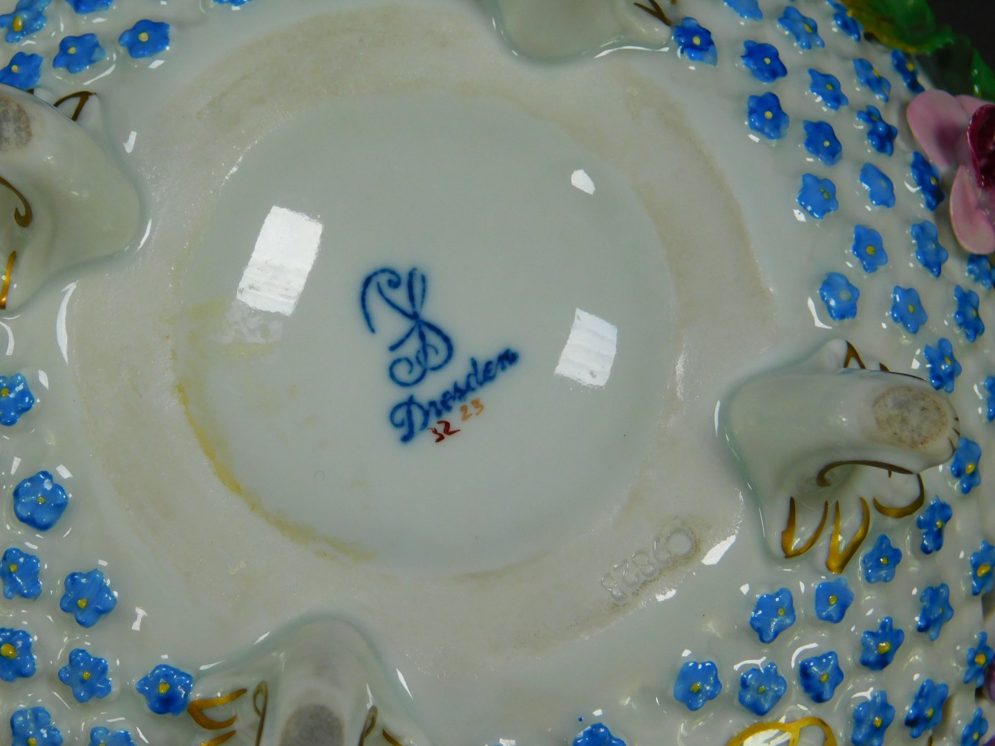 A 20thC Dresden porcelain bowl, of pierced form, encrusted and painted with flowers, raised on - Image 3 of 3