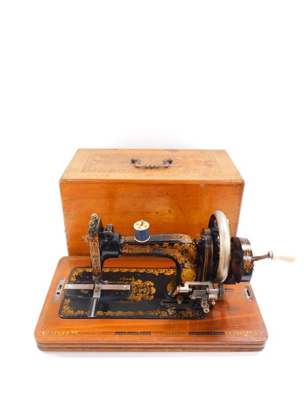 An early 20thC Frister & Rossman sewing machine, serial no. 1096571, cased.