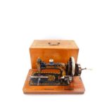 An early 20thC Frister & Rossman sewing machine, serial no. 1096571, cased.