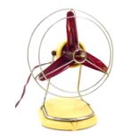 A Pifco cream and red Bakelite electric fan, No 1053.