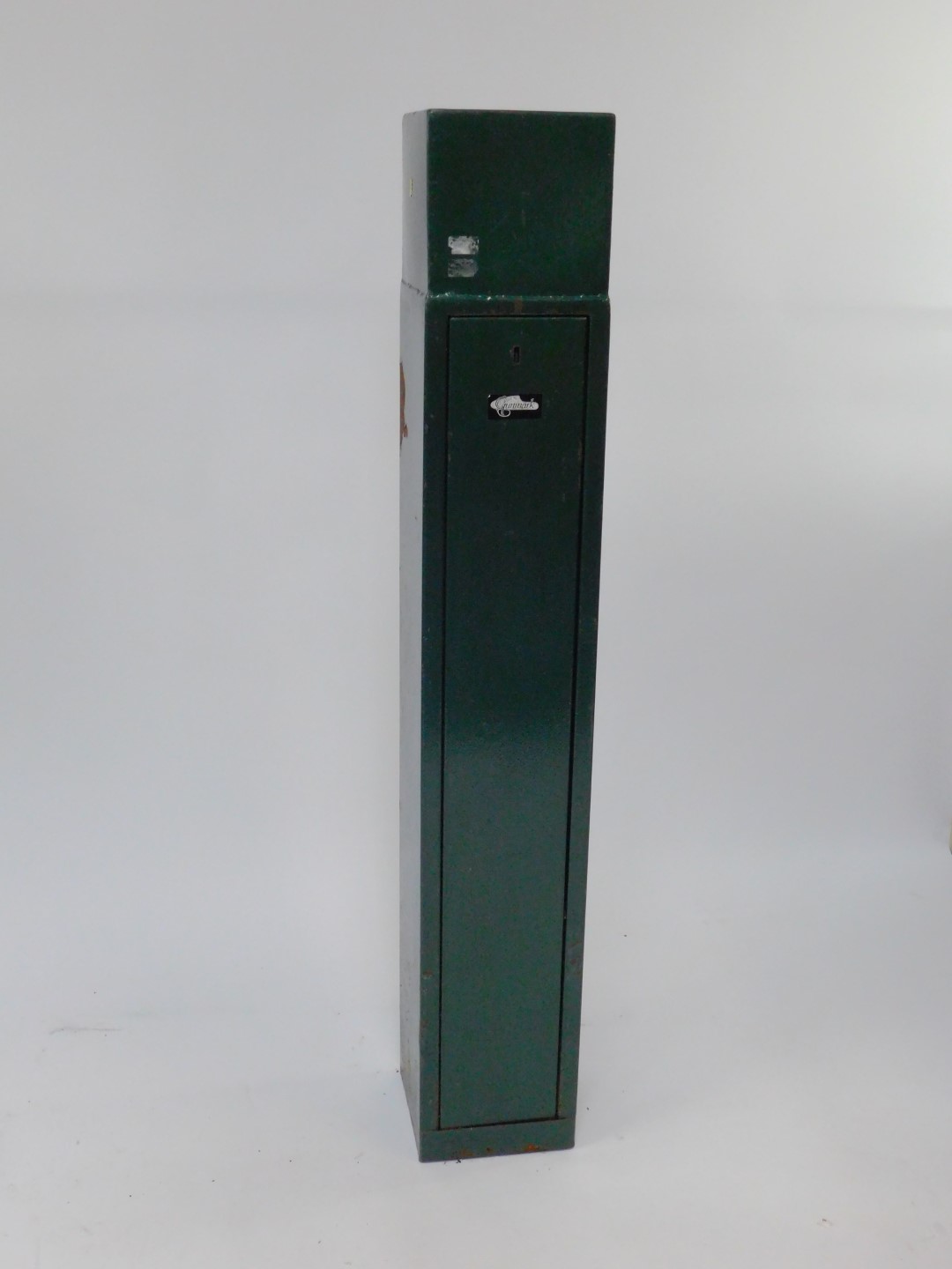 A Gunmark green metal gun cabinet, with keys.