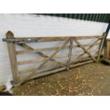 A large oak five bar braced gate with ironwork, 306cm wide.