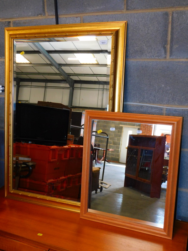 A gilt framed mirror, 104cm high, 74cm wide, together with a pine framed mirror, 60cm high, 49cm