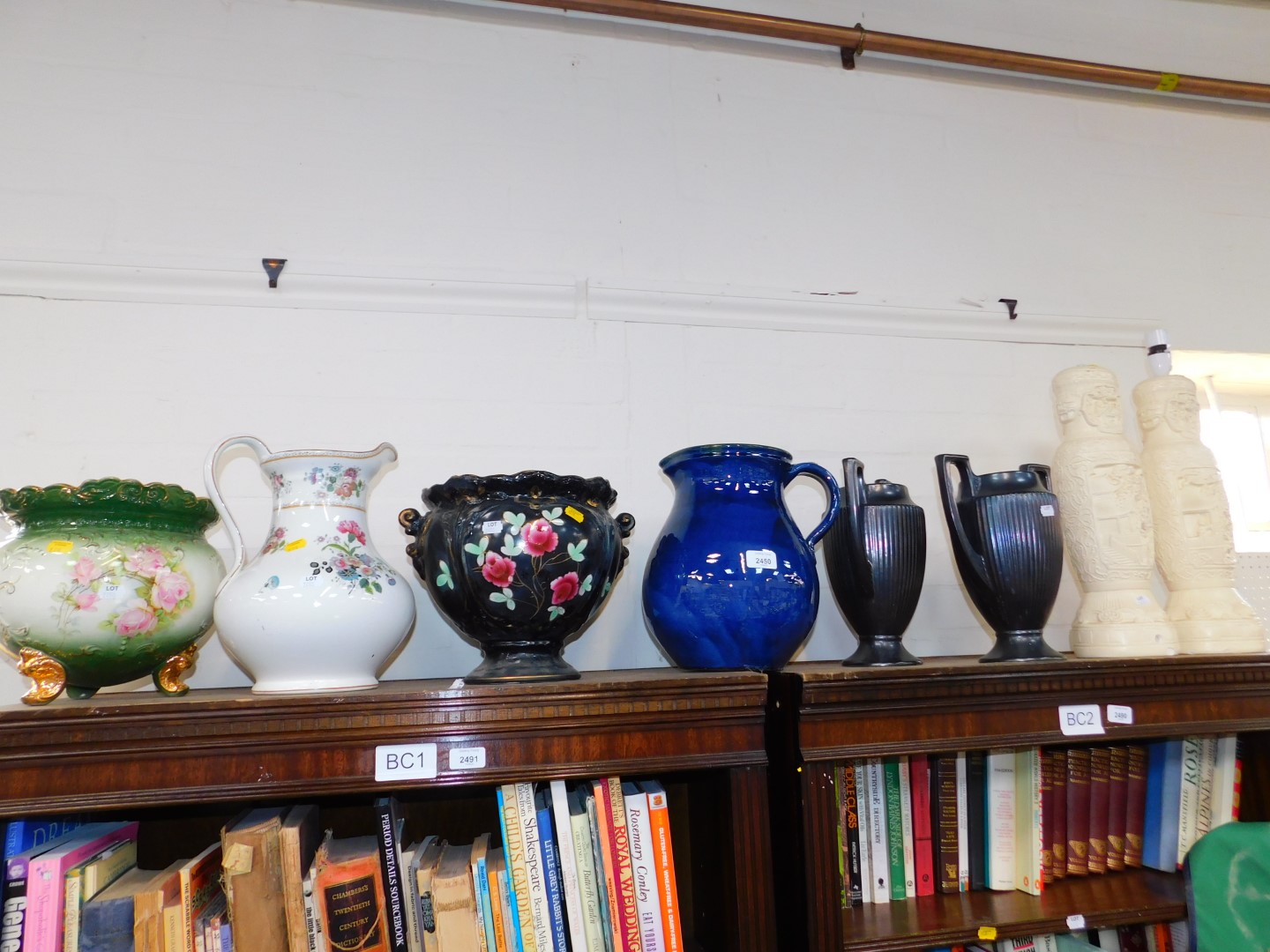A Devon pottery blue glazed jug, pair of Devon fluted black vases, two Victorian jardinieres, a pair
